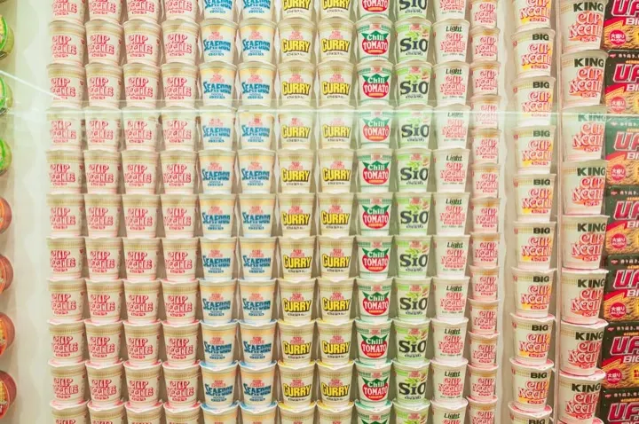 A wall display showing the huge variety of Nissin instant noodle products released over the years.
