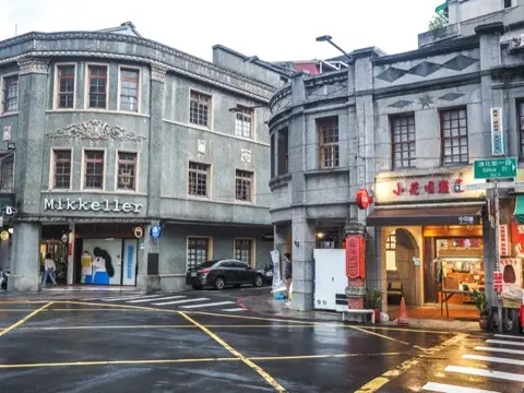 Historic heritage shopfronts at the street's entrance.