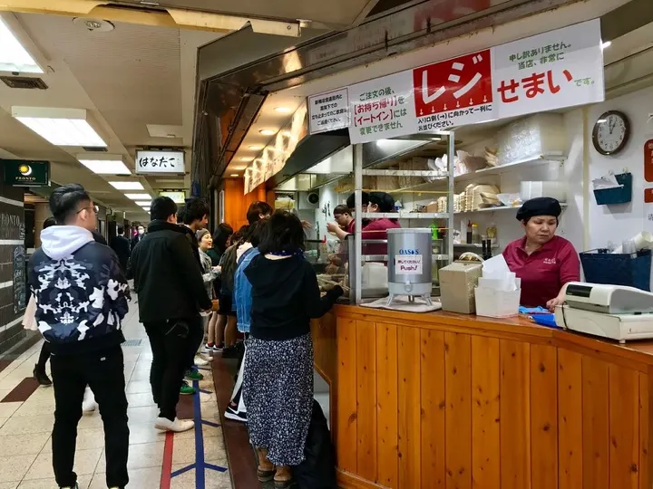 Hanadako, a Michelin Bib Gourmand takoyaki stand near Umeda Station known for its crispy-outside, molten-inside octopus balls.