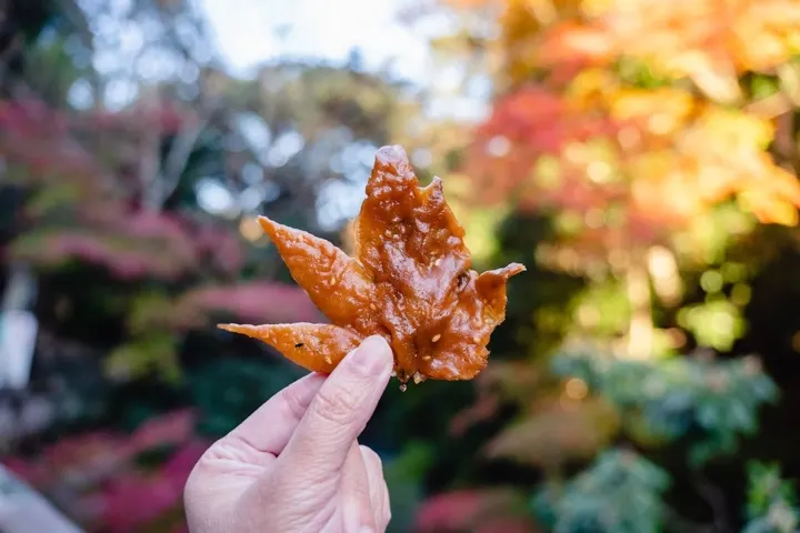 The finished momiji tempura snack, golden and crisp.