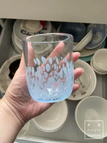 Finished hand-blown glass cup from the workshop.