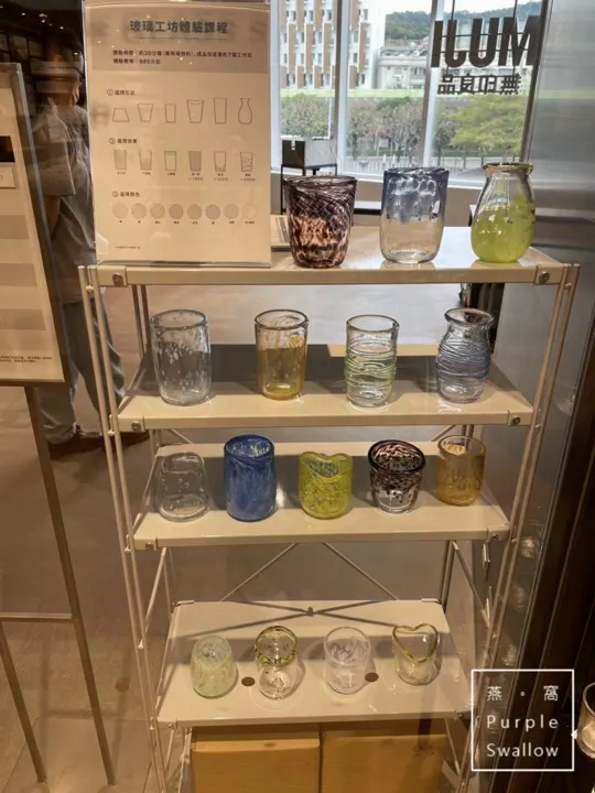 A display shelf showing the range of finished cup colors, patterns, and shapes participants can choose from.