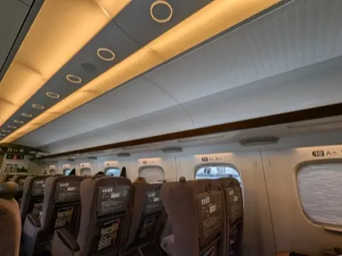 Overhead luggage storage.