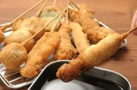 A giant kushikatsu restaurant signboard.