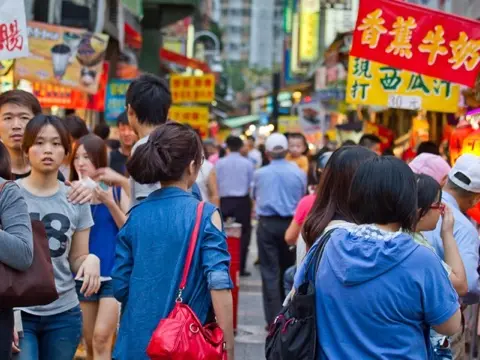 Shilin Night Market — busy pedestrian street.