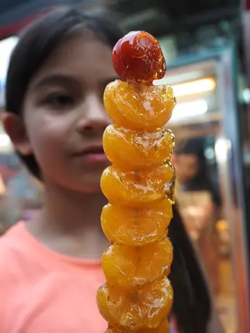Shilin: tanghulu candied fruit skewers.