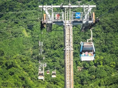 Boarding the Maokong Gondola cable cars.