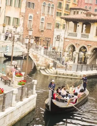 Venetian gondolas gliding through the harbor.