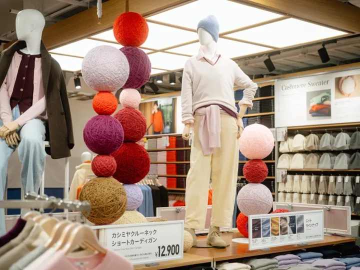 A cashmere sweater display inside the UNIQLO UMEDA flagship.