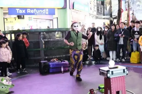 Street performance and youth-culture energy.